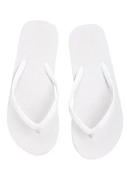 Pair of flip flops over white background