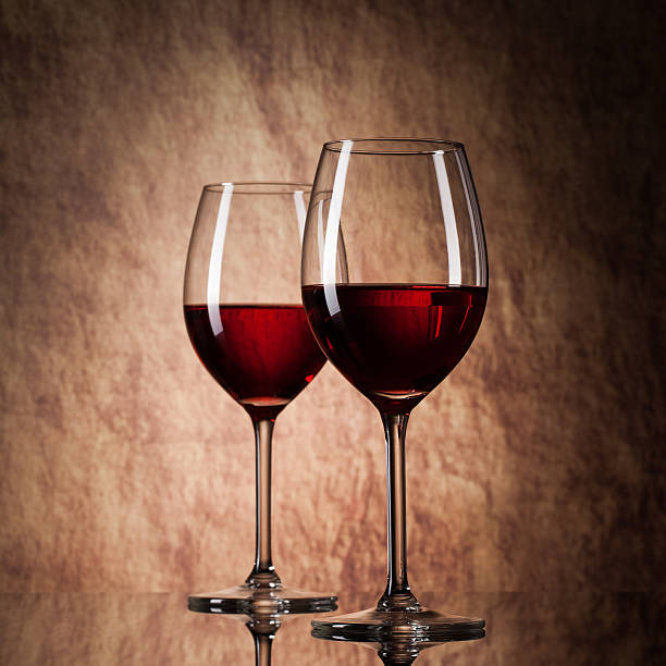 istock glass with red wine on a old stone background 177339114