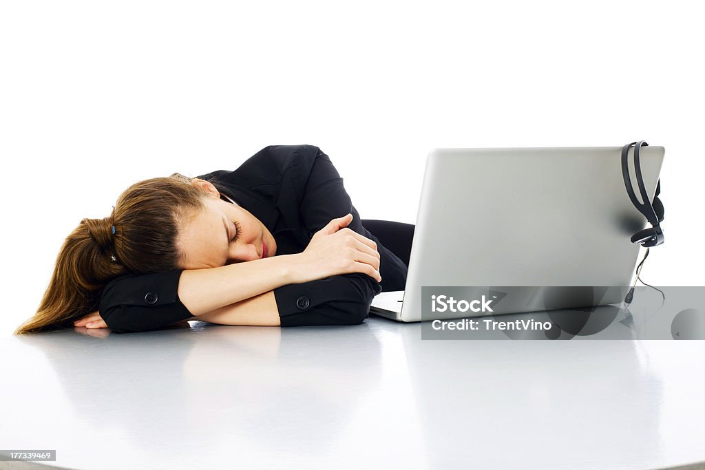 tired young businesswoman with laptop on white background studio Headphones Stock Photo