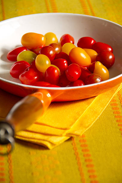 Making Tomato Sauce with Fresh Tomatoes stock photo