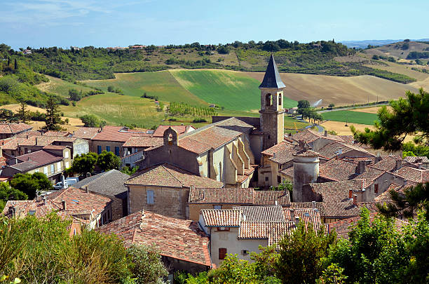 Village of Lautrec in France "Aerial view of village Lautrec with its church in southern France. Midi-PyrAnAes region, Tarn department" bell tower tower stock pictures, royalty-free photos & images