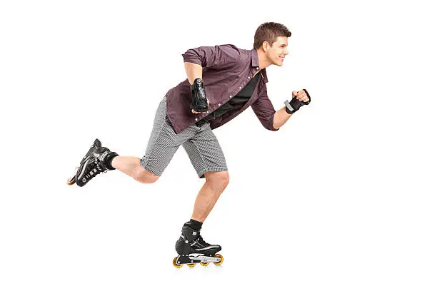 Full length portrait a male on rollers isolated on white background