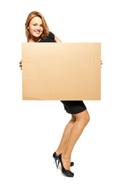 istock Attractive Woman Holding Up a Blank Sign - Isolated 177342096