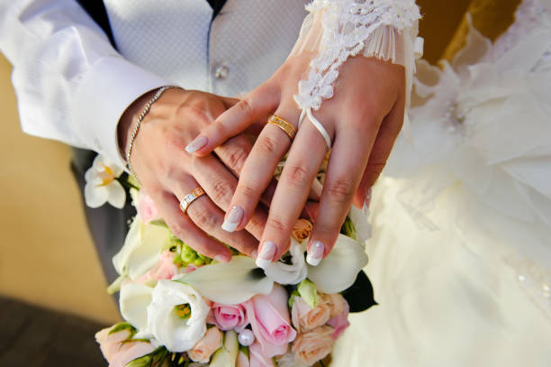 istock Wedding Bouquet with hands and rings 177342512