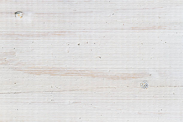 Close-up of the old plank with nails painted on white Close-up of the old plank with nails painted on white. patina photos stock pictures, royalty-free photos & images