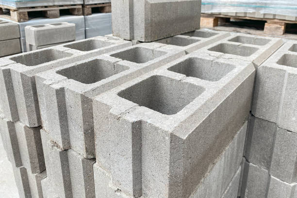 istock Stack on Pallet of Concrete Cinder Blocks, Grey Uniformed brick Shapes building material. New for use on construction site in Europe. 1773433296
