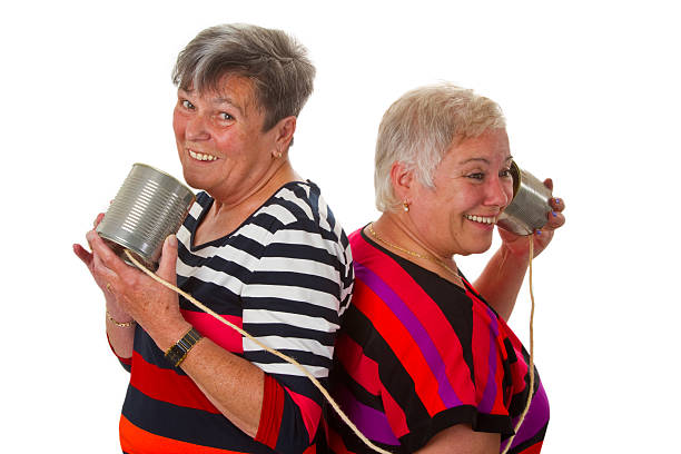 istock Female senior talking with can telephone 177344170