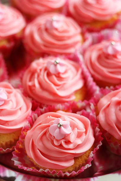 Cupcakes with pink fondant icing stock photo