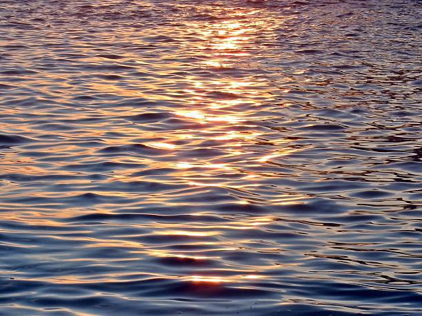 Sunbeam reflection on the sea in summertime stock photo