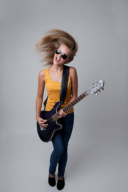 istock Young woman playing guitar. 177345776