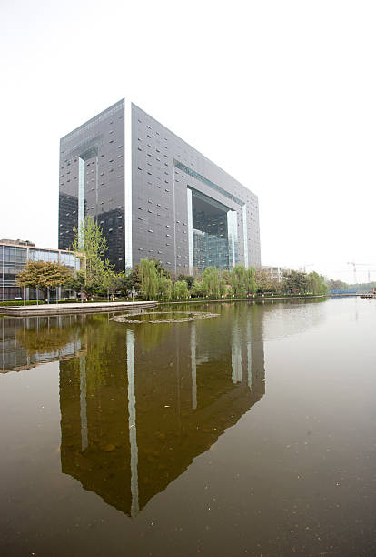 istock grey office building reflected in the lake 177345879