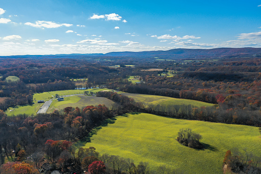 Sussex County, NJ, USA, lakes, mountain and farmlands on a sunny autumn day highlighted with beautiful fall foliage aerial views