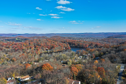Sussex County, NJ, USA, lakes, mountain and farmlands on a sunny autumn day highlighted with beautiful fall foliage aerial views