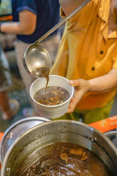 istock Put the rawon meat into a paper bowl 1773477375