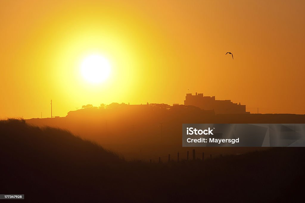 Castle bei Sonnenuntergang - Lizenzfrei Bamburgh Stock-Foto