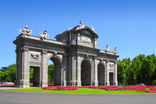 Madrid Puerta de Alcala with flower gardens in Spain