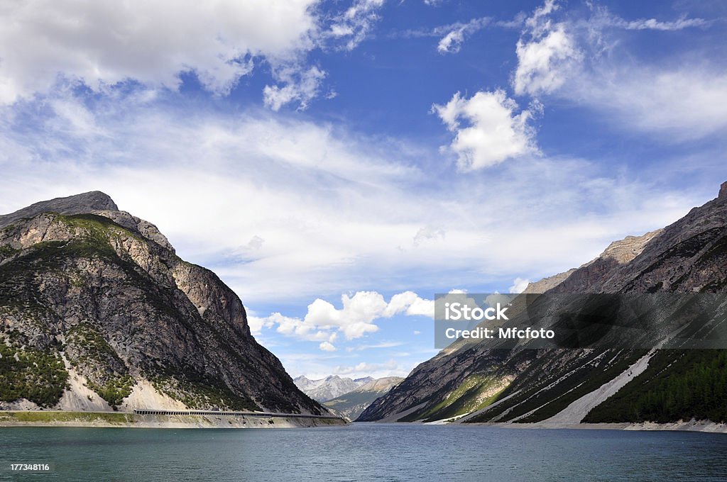 Mountain "Mountain lake with colorful sky in Livigno, italy" Dolomites Stock Photo