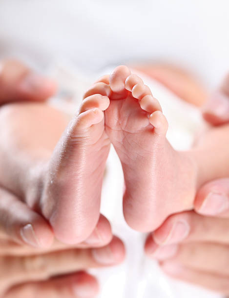 istock Newborn Baby feet 177348301