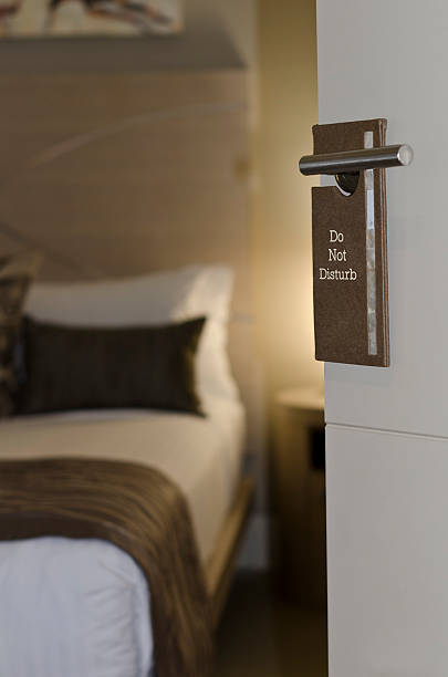 istock Do not disturb sign on hotel door 177348561