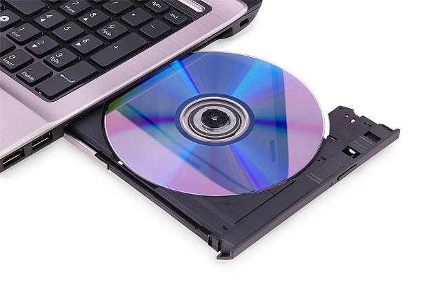 istock Laptop on white background. DVD disc in the drive. 177348624
