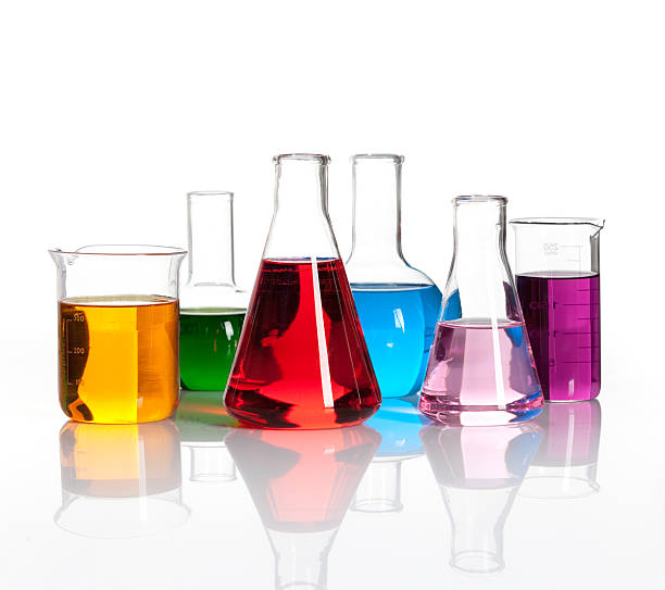 Set of laboratory flasks with a colored liqiuds Set of laboratory flasks with a colored reagents, isolated chemistry beaker stock pictures, royalty-free photos & images