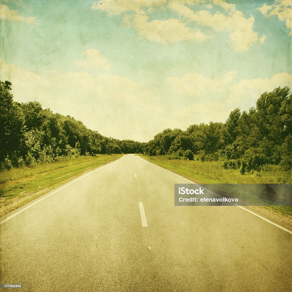 Retro image of empty asphalt road. Empty asphalt road in grunge and retro style. Asphalt Stock Photo