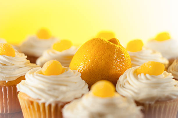 istock Lemon Frosted Cupcakes Against Yellow Backdrop 177351284