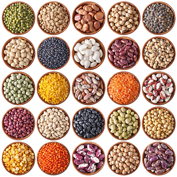 collection of wooden bowls with legumes collection of wooden bowls with legumes isolated on white background adzuki bean photos stock pictures, royalty-free photos & images