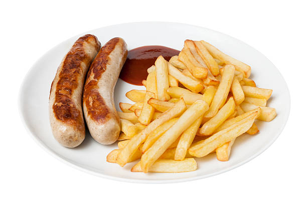 Bratwurst and french fries stock photo