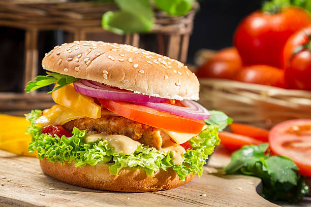istock Chicken with fresh vegetables on sesame seed bun 177353652
