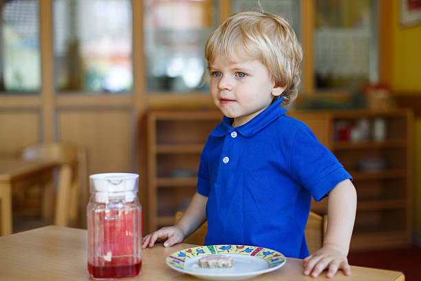istock Little boy of two years having breakfast at nursery 177354065