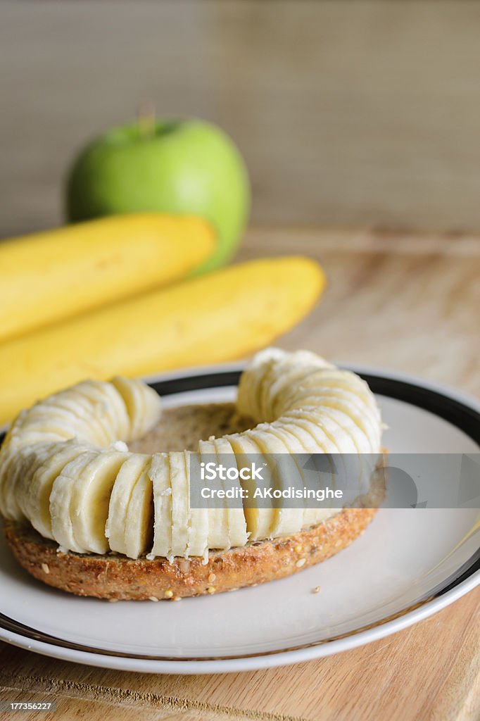 Bagel with sliced banana Apple - Fruit Stock Photo
