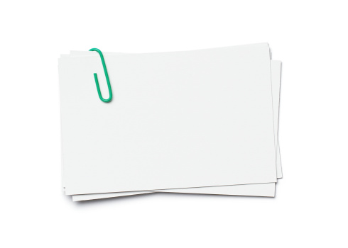 Stack of business cards with paper clip isolated on white background, clipping path included