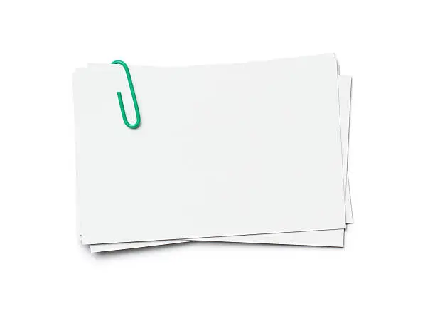 Stack of business cards with paper clip isolated on white background, clipping path included