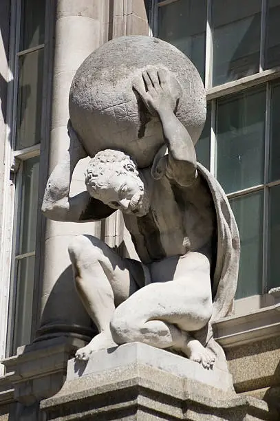 "Public statue of the mythological character Atlas, carrying the globe on his back. In Greek mythology, the Titan holds up the celestial sphere.  Statue sculpted by the now defunct Farmer & Brindley works and on public display since 1894.  Viewed from public pavement in the City of London."