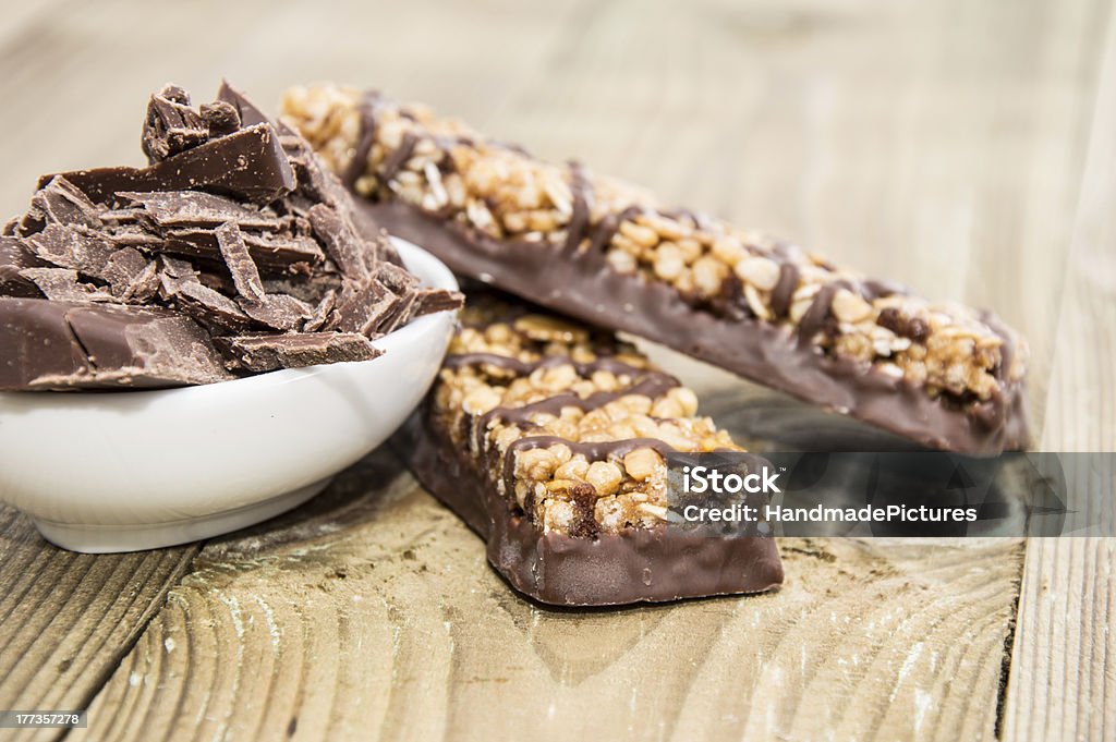 Muesli Bars with Chocolate in a bowl Muesli Bars with Chocolate in a bowl on wooden background Chocolate Stock Photo