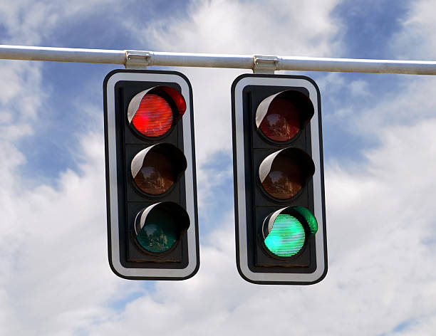 Traffic lights red and green Red and green traffic lights against blue sky backgrounds red light stock pictures, royalty-free photos & images