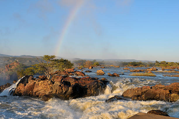 Sunrise at the Ruacana waterfall, Namibia Top of of the Ruacana waterfalls on the border of Namibia and Angola at sunrise kaokoveld stock pictures, royalty-free photos & images