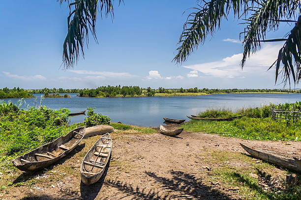 canoes resting at the shore of the zambezi river in Zambia