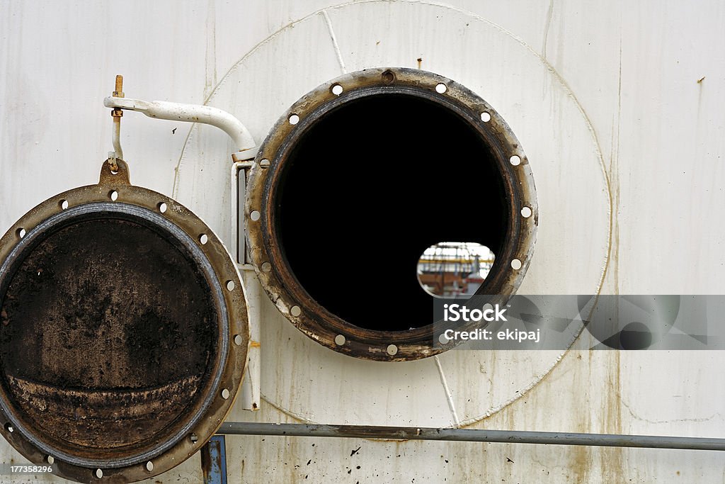 Open the hatch. Open the hatch in the oil tank. Circle Stock Photo