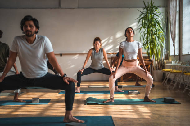 istock Mid Adult Indian Male Pilates Instructor in Class  With Multiracial Group 1773583964