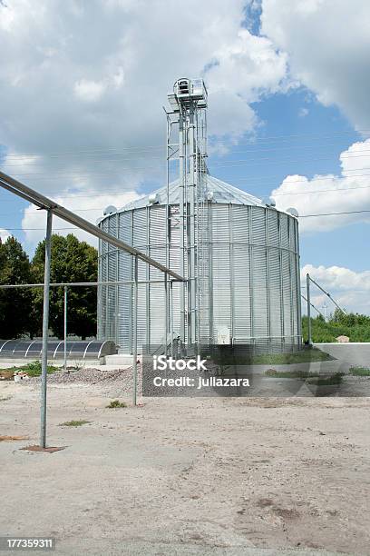Grain Silos Under Clouds Stock Photo - Download Image Now - Agriculture, Blue, Cereal Plant