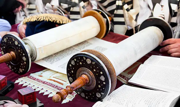 "Jewish reading pray from Torah, ancient scrolls at the western wall on a jewish holiday Israel's 64th Independence Day on April 26, 2012 in Jerusalem, Israel"
