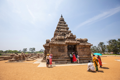 Mahabalipuram, India - October 3, 2023. People of Indian ethnicity view the Shore Temple in Tamil Nadu.