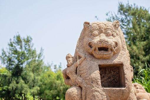 Dol hareubang stone grandpa sculpture at Daepo Jusangjeolli park in Jeju Island, Korea