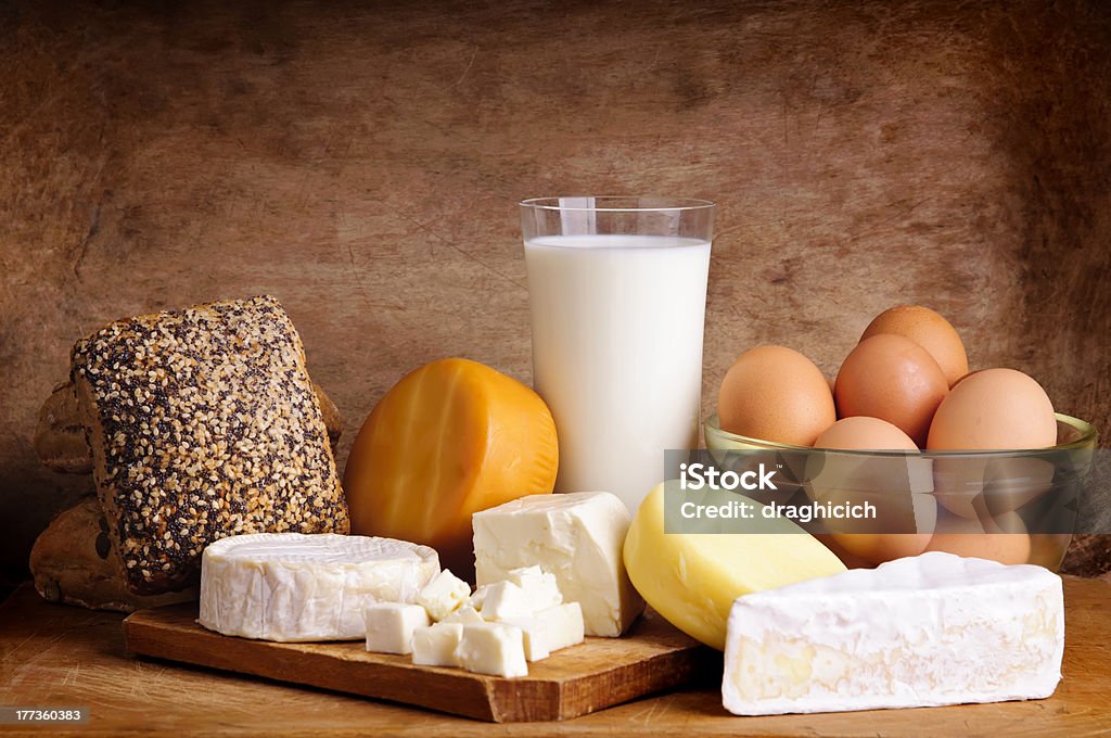 cheese, bread, milk and eggs "still life with dairy products, milk, eggs, bread and cheese on a vintage wooden background" Egg - Food Stock Photo