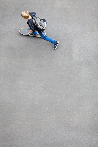 teen boy skateboarding