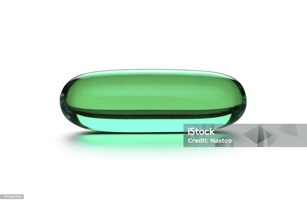 Zielona tabletka - Zbiór zdjęć royalty-free (Kapsułka)