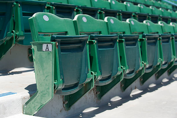 Baseball Stadium Seats Rows of empty seats at a baseball stadium. baseball stadium chairs stock pictures, royalty-free photos & images