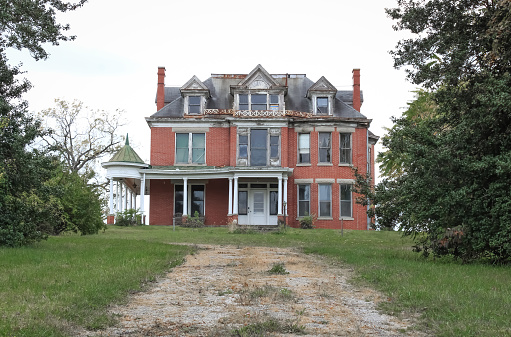 A beautiful, Victorian era mansion on a hilltop in the countryside near Lexington, Kentucky